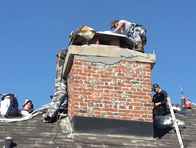 Waxhaw Chimney Sweep installing a custom chimney crown in Waxhaw, NC