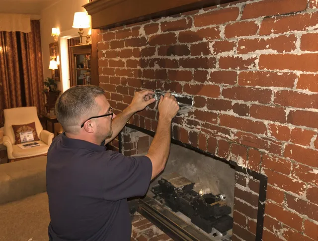 Waxhaw Chimney Sweep expert fixing a fireplace in Waxhaw, NC